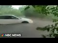 Officers rescue infant from flooded car in Texas as storms snarl holiday travel