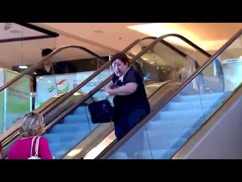 Woman Chases Clown Down An Escalator After Getting Hit In The Face With A Pie