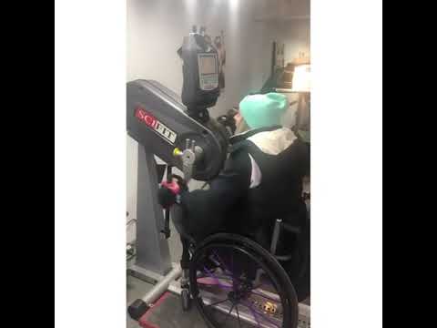 Kylie uses her hand-bike to train