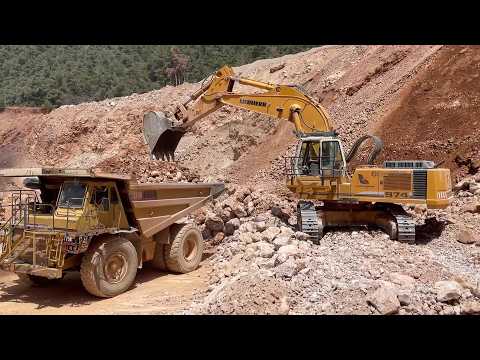 Liebherr 974 Excavator Loading Blasted Rock Onto CAT 775B Dumper At Quarry - Sotiriadis/Labrianidis
