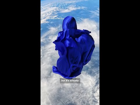 A silk figure floats at the edge of space