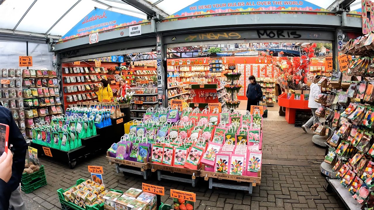 Embark on an enchanting walking tour of the vibrant Bloemenmarkt.