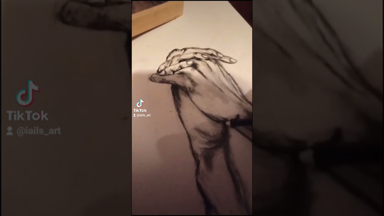 drawing holding hands with charcoal