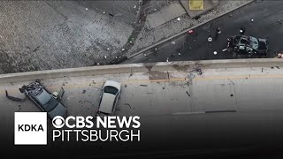 2 killed in violent 5-car crash that sends car off ramp