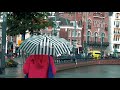 A Woman Wearing Red With Her Umbrella In The Rain In Amsterdam 4K Stock Video