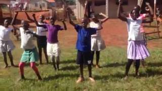 Children in Uganda sing  "I am a Superhero" by Lourds Lane
