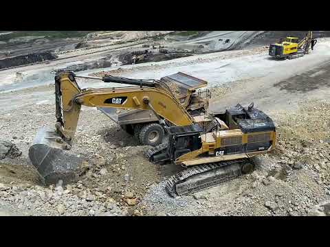 Caterpillar 385C Excavator Loading Caterpillar 775E Dumper & Trucks - Pyramis Ate