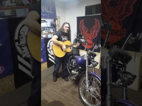Theron Roberson blessing a restored shovelhead.