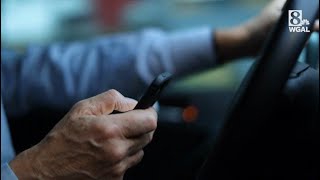 Law banning handheld devices while driving goes into effect next month