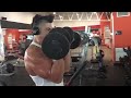 Athlete Working Massive Bicep Curls. Young bodybuilding motivation. Arm day