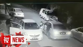 CCTV captures armed men with machete robbing Grab driver