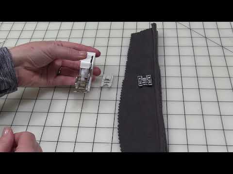 Part of a video titled How To Use The Sewing Machine Roller Foot - YouTube