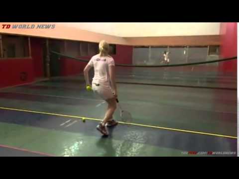 TV presenter Mike Bushell tries real tennis with a trench