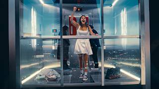 They End Up Trapped in a Glass Elevator 1,000m in The Air in an Empty Building