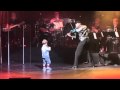 Three year old Alex Cameron plays the violin in Daddy's show