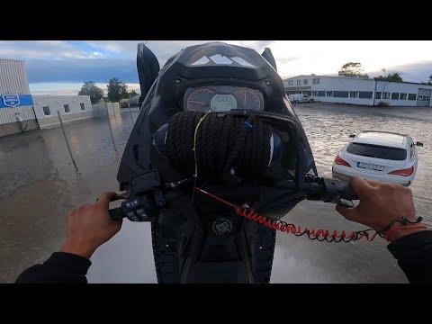 Snowmobiling in flooded city 2021