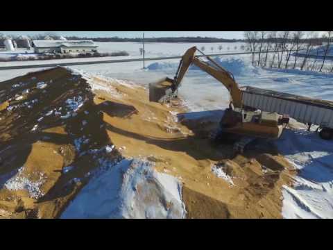 Loading Corn With Excavator