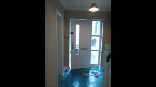 Painting a stairs with a wooden handrail that is stained and then varnished .