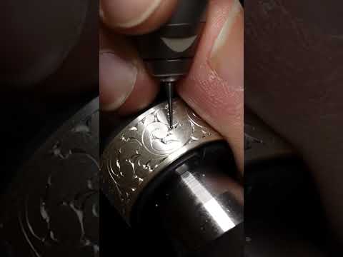 Background removal using a micro rotary burr. #handengraving #customengraving #scroll #jeweler