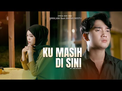 Aprilian ft Rheka Restu - Ku Masih Di Sini (Official Music Video)