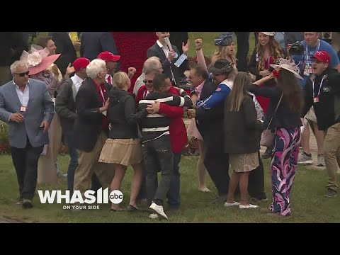 Trainer Eric Reed celebrates after long-shot Rich Strike's upset Kentucky Derby win