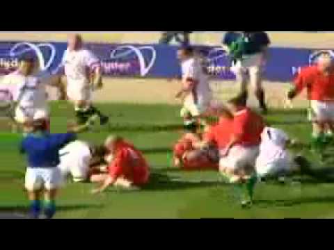 Craig Quinnell runs over Steve Hanley 1999 Five Nations)
