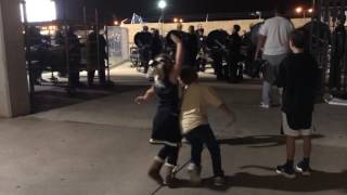 Juliette and Walker do high kicks at the game NOV 2016