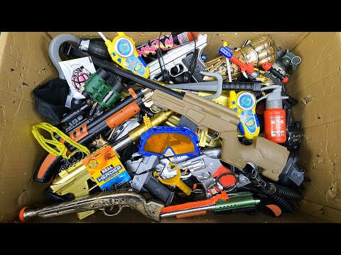 Box of Toy Guns And A Realistic Special Army Rifle, Equipment, Gold Tec-9 And Other Toy Guns