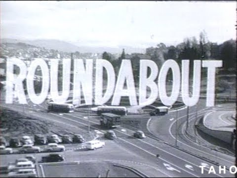 Cover image for Film - Roundabout - the purpose of traffic roundabouts and how they should be used for best effect. Made for the Transport Department. Copyright TAHO