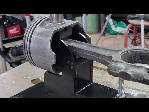 Wrist pin removal from forged pistons and stock rods with homemade tool.