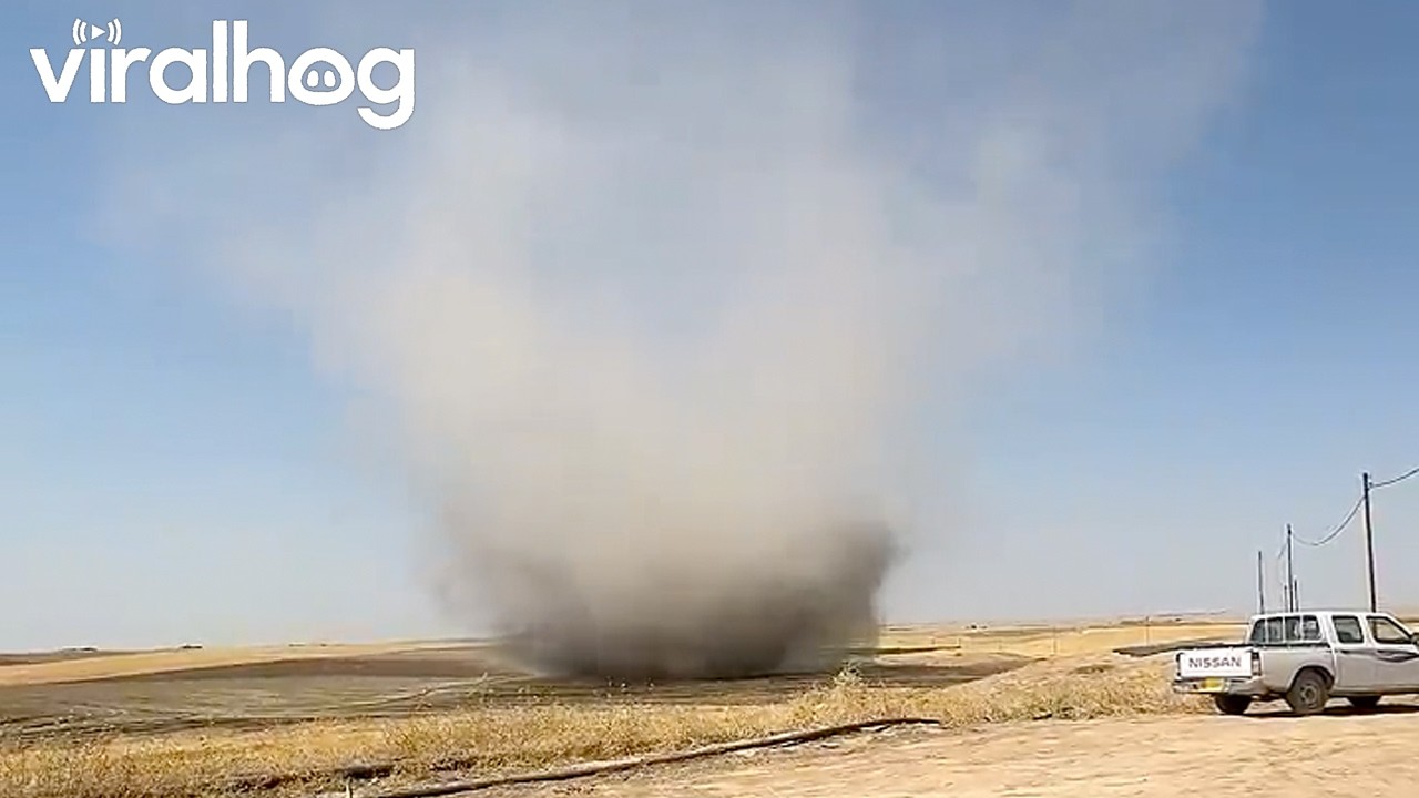 Massive Dust Devil Moving Across Open Field || ViralHog