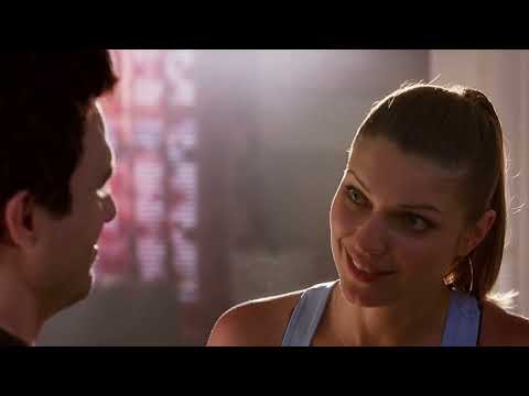Official trailer frame from Just Like Heaven (2005): David and Elizabeth on a San Francisco rooftop at dusk