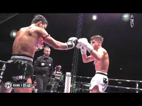 Manasak Pinsinchai signature left kick wins Lion Fight World Title.