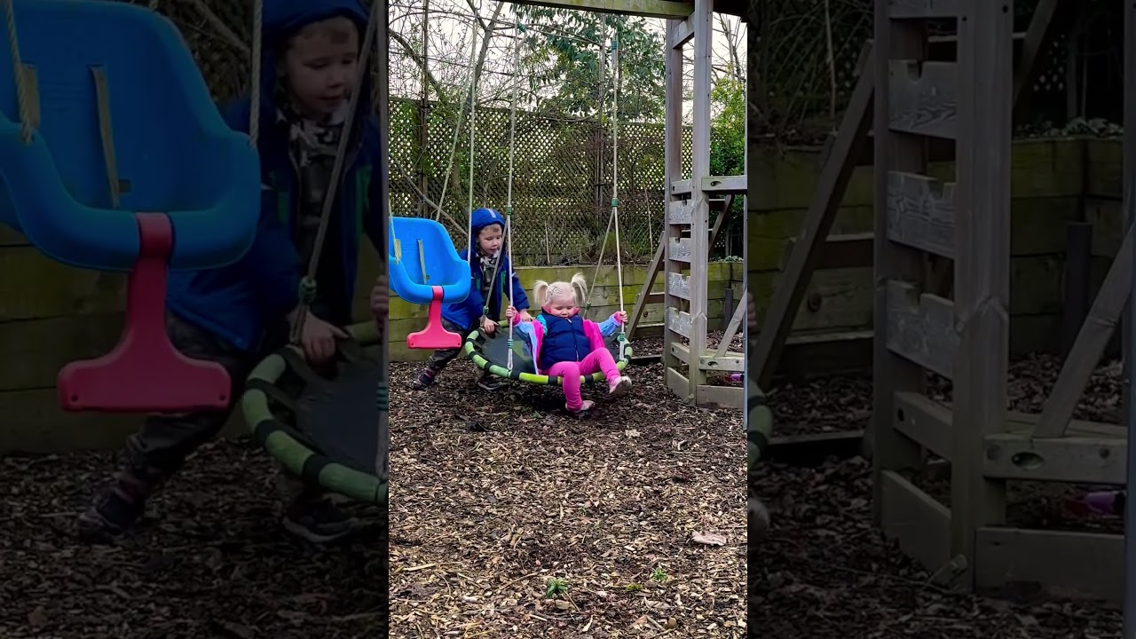 pushing lil sister on swing