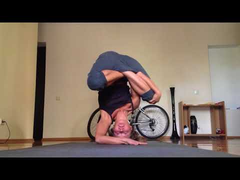 Lotus Bound Headstand with support