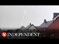 Moment lightning bolt strikes couple's home in Oxfordshire and destroys roof