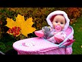Baby Annabell doll is crying. Baby doll goes for a walk & a toy stroller for Baby Born dolls.