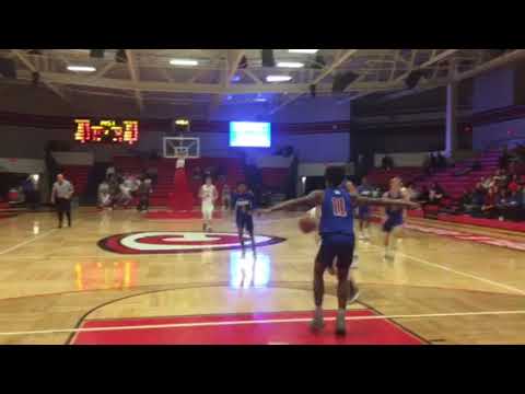 Racine Lutheran's  Nathan Zawicki powers for a three-point play