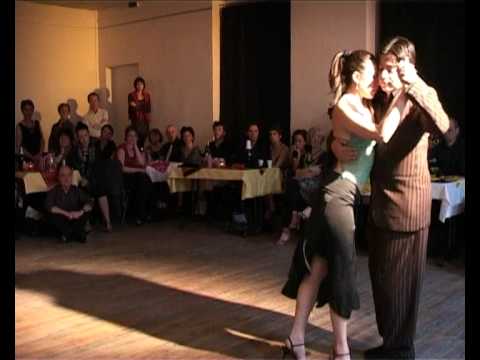  Pamela Ramos Aracena  and  Carlos Espinoza  are  dancing  to  the  tango  "  Alguien  "  by  Rodolfo Biagi