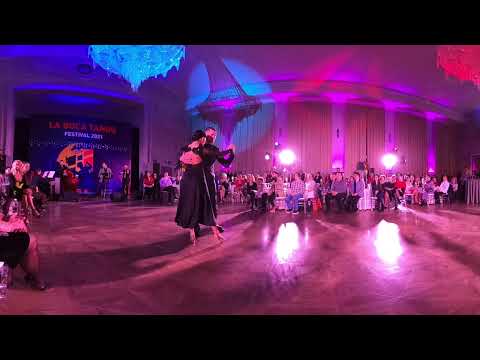  Anton Popichenko  and  Svetlana Berlin  are  dancing  to  the  tango  "  Paciencia  "  by  Solo Tango Orquesta  at  La Boca Tango Festival  in  2021