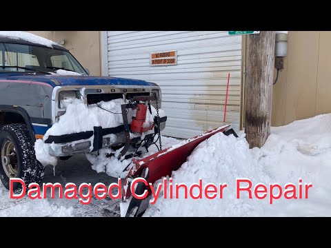 Repairing a damaged snow plow cylinder.