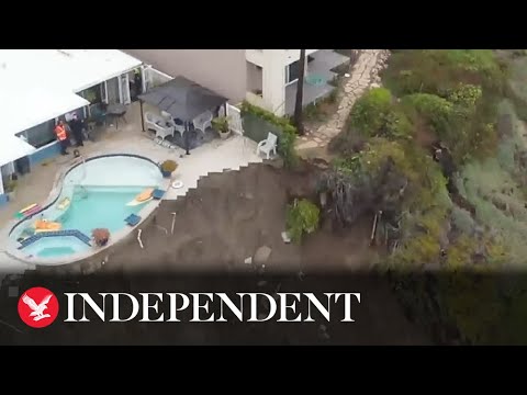 Swimming pool hangs over edge of crumbling cliff after landslide in California