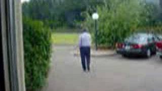 Bobby Cheezy - Idiot Boss paces parking lot on cell phone