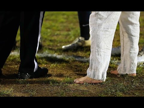 This New Jersey football coach is barefoot for every game