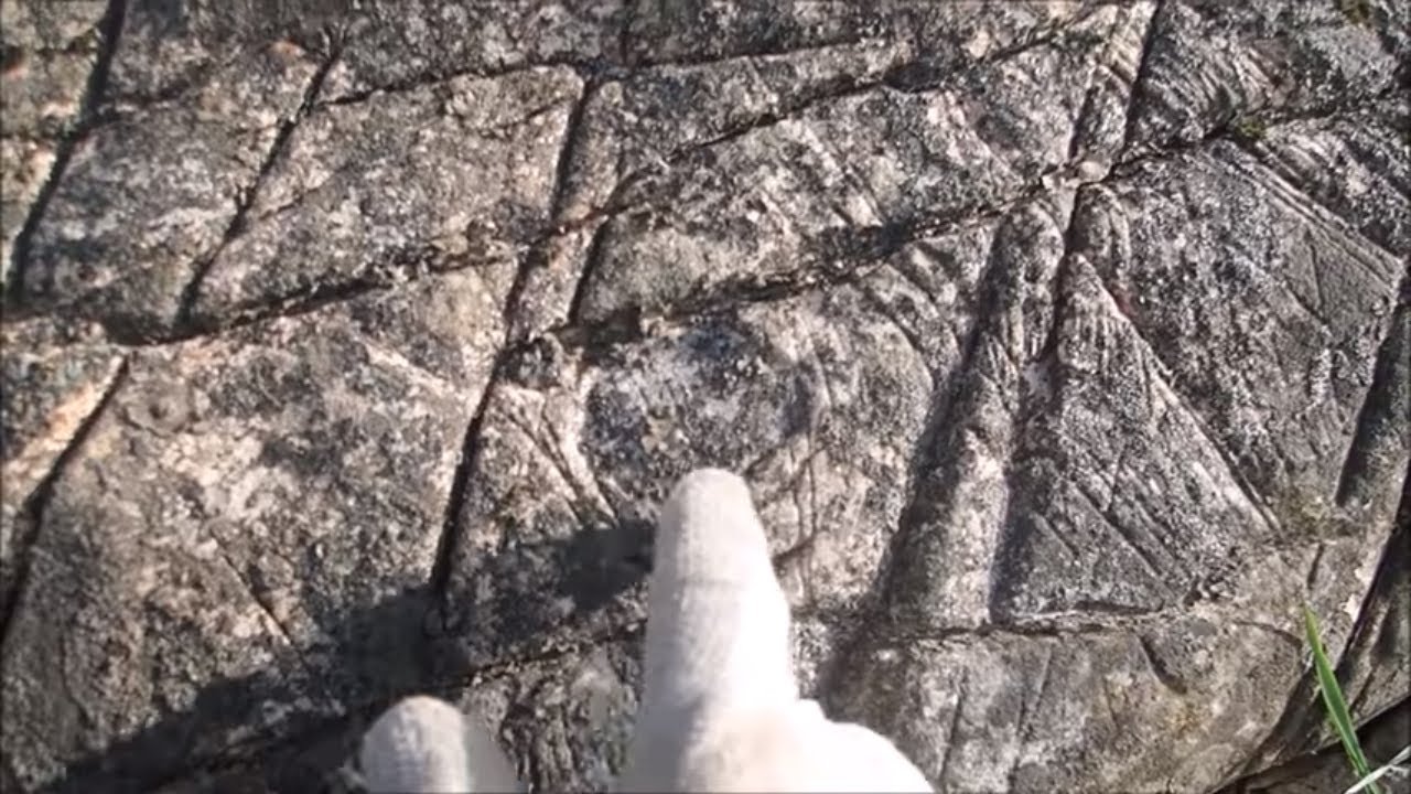 What Are These Unknown Symbols On This Ancient Rock?