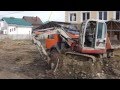 Гусеничный миниэкскаватор TAKEUCHI TB125 грузит самосвал КАМАЗ с ...