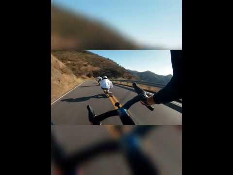 longboarders v cyclist, who is win? #shorts  #travel #youtubeshorts