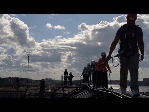 Tourists take a tour of Stockholm's rooftops | AFP