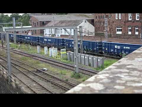 The Class 68 DRS No.68007 'Valiant' with JNA Bogie Open Wagons is passing outside North at Carlisle.