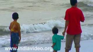 Playing in the surf at Kozhikode beach  